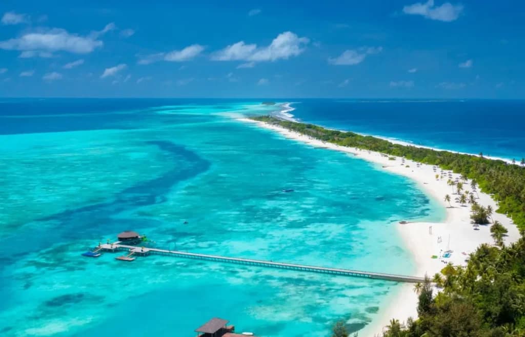 Atmosphere Kanifushi - 5-star resort in Lhaviyani Atoll featuring pristine beaches, crystal-clear lagoon, and overwater villas